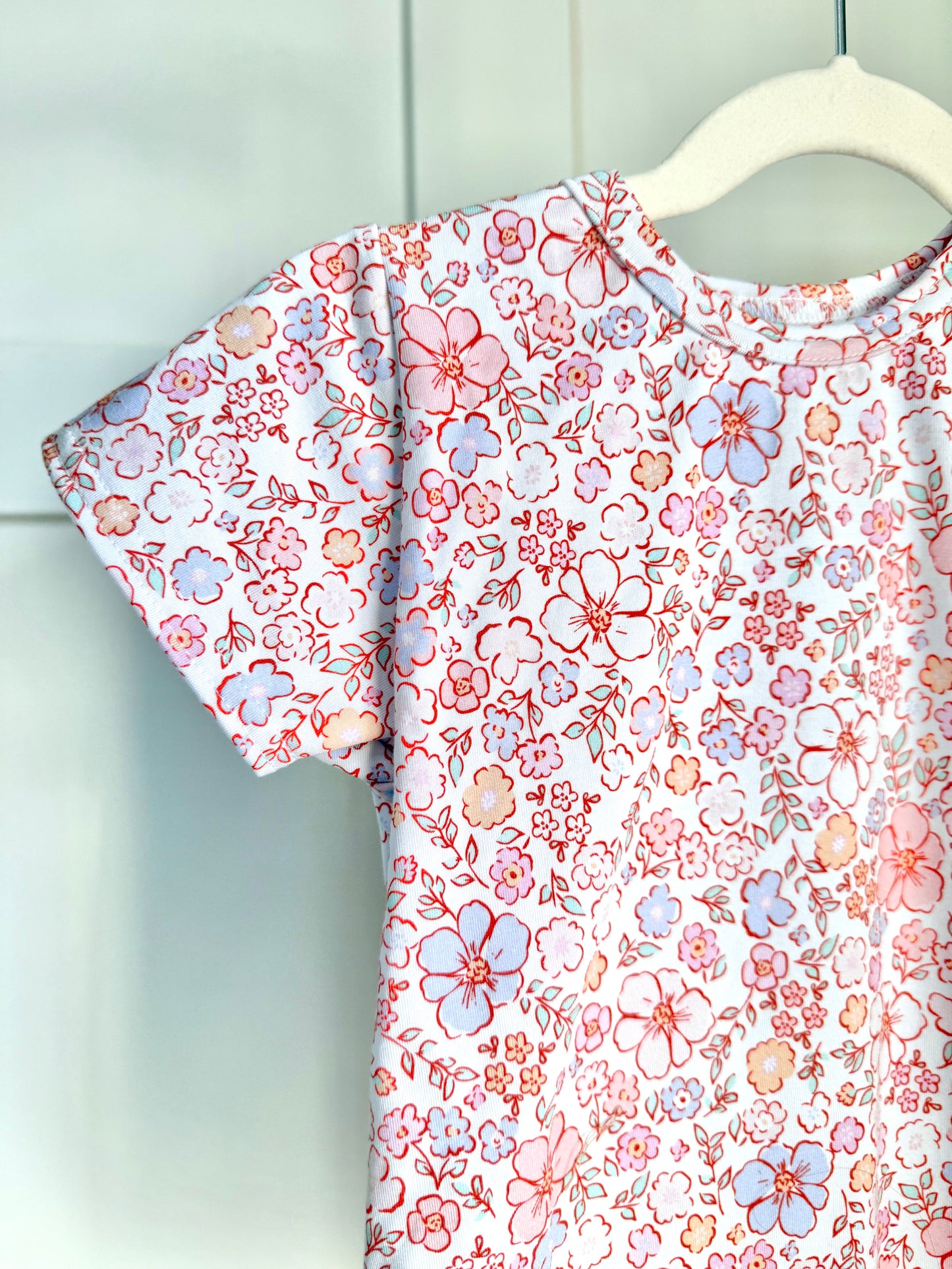 Pastel Petals Curved Hem Tee
